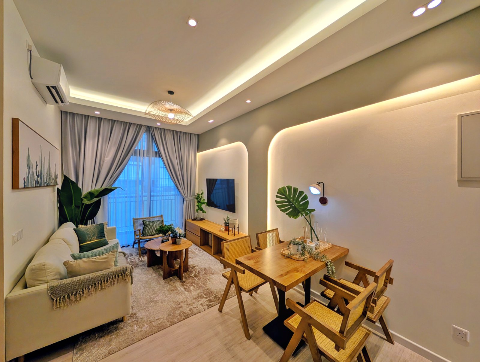 Type B show unit living and dining area with curved feature wall